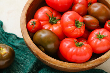 Bowl with different fresh tomatoes, closeup