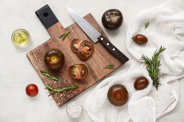 Fototapeta na wymiar Board with fresh tomatoes and rosemary on white background