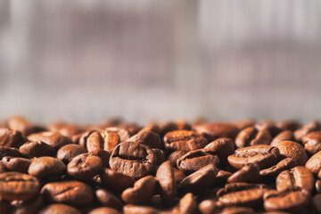 Close Up of Tounded Coffee Grains in an blurred background. Text space.