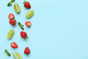 Fresh strawberries with lime and mint on turquoise background