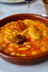 Fabada asturiana, Asturian bean stew, Spain, hot and heavy dish served with Asturian cider or a red wine, made with fabes de la Granja large white beans, shoulder pork, pancetta or bacon