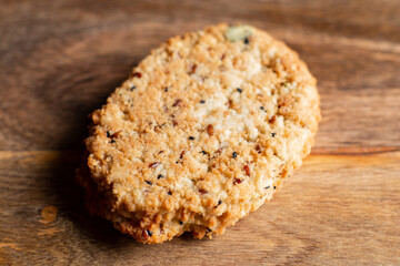 Vegetarian cutlet on a wooden background. Cutlet without meat. Vegan food. Close-up.