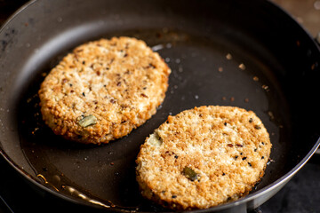 Vegetarian meatballs. Cooking in a pan. Meat alternative food. Cutlets from beans, seeds.