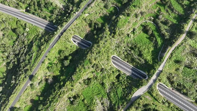 Aerial video of highway with ecoducts to allow for safe passage of wildlife on Tenerife, Spain