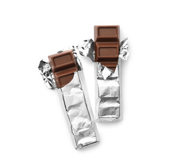 Delicious sweet chocolate bars on white background, top view
