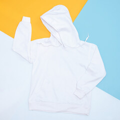 Blank hoodie sweatshirt color white on colorful background