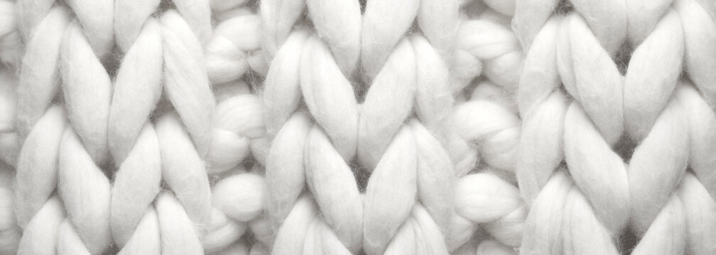 White knitted fabric as background, top view. Banner design © New Africa