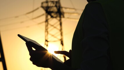 silhouette electrical engineer, work tablet sunset, electric tower, digital hand, sunset voltage...