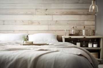 Over a fuzzy bedroom with a double soft bed, a wooden wall panel, and country provencal white interior architecture, a wooden table top or shelf with fragrant sticks bottles is seen. Generative AI