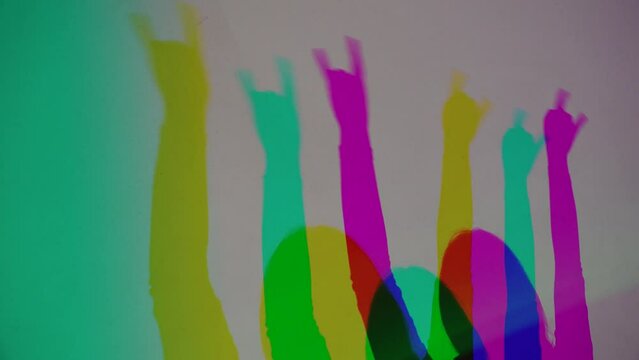 colorful shadows of dancing people disco