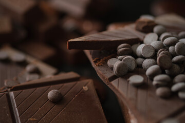 Closeup view of pieces of chocolate bar with chocolate chips.