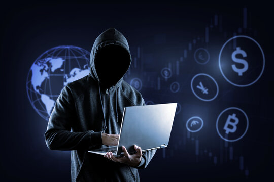 Cybercrime hacking crypto currency and technology crime. no face hacker with laptop.