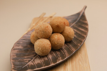 Croquette on ceramic plate and wooden board, isolated