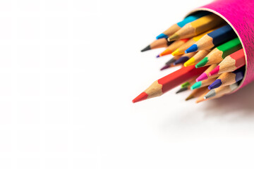 Many pencil colors in box isolated on white paper background.Red pencil offside each other.Leader business concept with copy space.Blank or empty clipboard.Red sanding out.Leadership and independence.