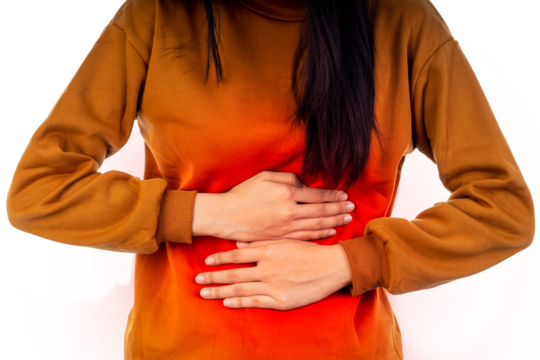 Close-up of Young Asian woman was sick with stomachache, putting her hands on belly with red spot, standing.