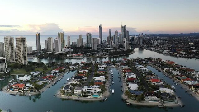 Aerial view fly back over Macintosh island waterfronts, with a southerly view towards Surfers Paradise, Gold Coast.