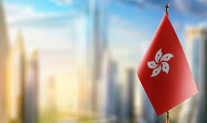 Small flags of the Hong Kong on an abstract blurry background