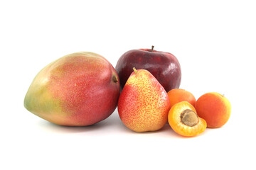 Multicolored mango pear apple and apricot over white