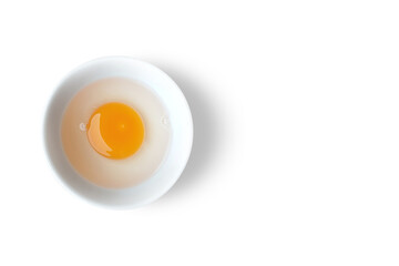 Raw Egg Yolk On A White Bowl - Flat Lay View - Top View