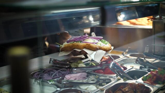Chef Put Red Onion Slices On Top Of Hungarian Langos. - close up