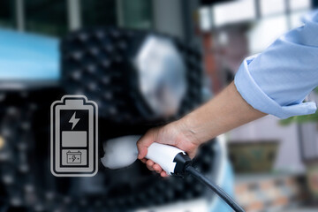 Battery icon symbol electric car on the blurred background of electric cars, Eco friendly vehicle concept