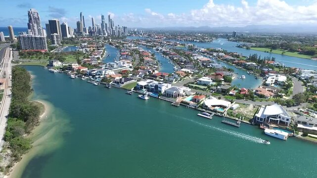 Aerial view circling Macintosh island  and waterfronts, with a southerly view towards Surfers Paradise. Gold Coast, Australia