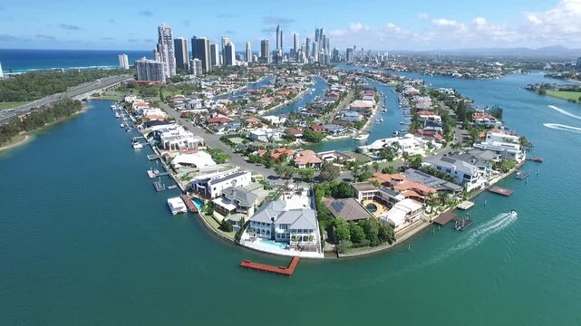 Aerial view circling Macintosh island  and waterfronts, with a southerly view towards Surfers Paradise. Gold Coast, Australia
