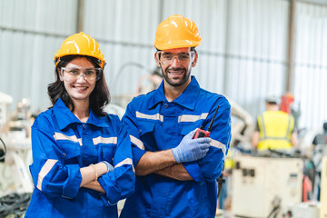 professional technician engineer with safety helmet hard hat working in industrial manufacturing...
