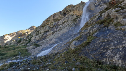 Fototapeta na wymiar pretty mountain ridge high land fast water fall at summertime day - photo of nature