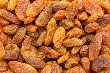 Close-up sweet yellow raisin background.