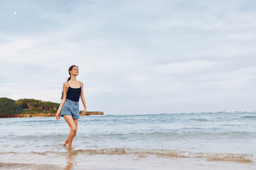 Fototapeta na wymiar woman lifestyle young running happiness smile beach sunset travel summer sea