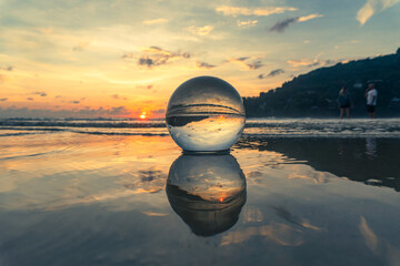 Magnificent sky above the crystal ball on the beach..The beautiful reflection of the sky above the...