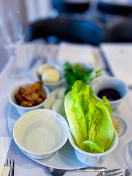 The main meal on Pesach is the Passover evening, or seder. the main dish is a plate for the seder. in Hebrew - keara. There are 6 products on it - an egg and a chicken wing, greens, water, etc.