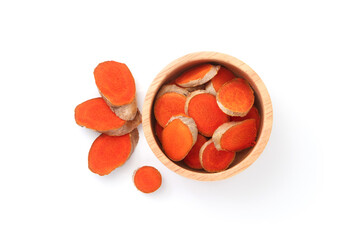Turmeric slice in wooden bowl isolated on white background , top view , flat lay.