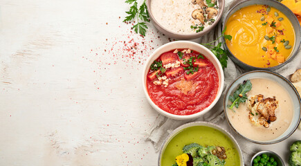 Composition with various soups, ingredients and space for text on white background. Healthy food. - obrazy, fototapety, plakaty