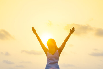 new morning woman lifting arms stretching welcome the morning sun health concept