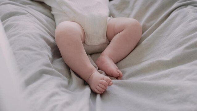 Detail of feet of unrecognizable toddler. Shot with RED helium camera in 8K.