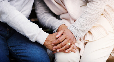 Holding hands, senior couple and support while together for empathy, love and care in marriage. Closeup of elderly man and woman with hope, respect and communication or kindness outdoor in retirement