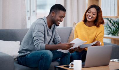 Home, smile and black couple with paperwork, laptop and discussion with budget, conversation and planning funding. Partnership, man and woman with technology, talking and documents for investments