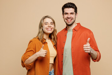 Young smiling happy couple two friend family man woman wear casual clothes looking camera together...