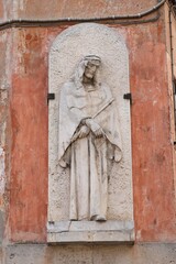 Fototapeta na wymiar Saint Francis of Assisi Relief on a Wall in Trastevere, Rome, Italy