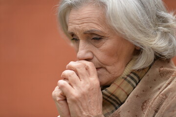 Close up portrait of unhappy old woman
