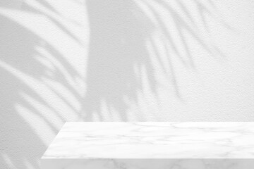 Minimal White Marble Table Corner with Coconut Leaves Shadow and Light Beam on Concrete Wall Background, Suitable for Product Presentation Backdrop, Display, and Mock up.