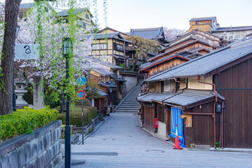 Fototapeta na wymiar Japan - March 30, 2023 : Scenic view of Japanese Historical Wooden Houses at Ninenzaka and Sannenzaka, One of most famous tourist destination in Higashiyama district, Kyoto