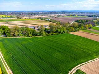 Aerial view landscape. View of fields in the countryside, blue sky, agritourism polish.