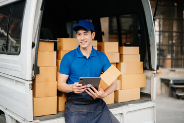 Portrait of courier delivery Asian man searching the address on digital tablet. Delivery service, delivery home and shipping concept...