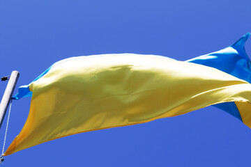 Sunlight flag of Ukraine waving in wind