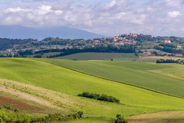 Fototapeta na wymiar The Orciano Pisano countryside with Lorenzana in the background, on a sunny spring day, Pisa, Italy