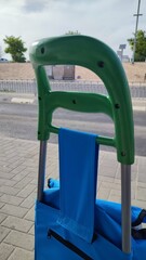 a food trolley with a handle stands on the street