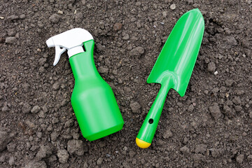 Scoop and spray bottle on the ground